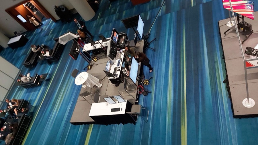 Overhead view of the on-location control cart setup in a convention centre