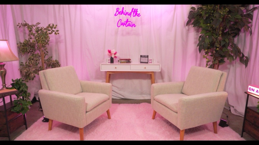 Pink neon-lit custom podcast set, Behind the Curtain