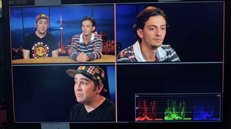 Multi-camera monitor wall in the control room during a live cut